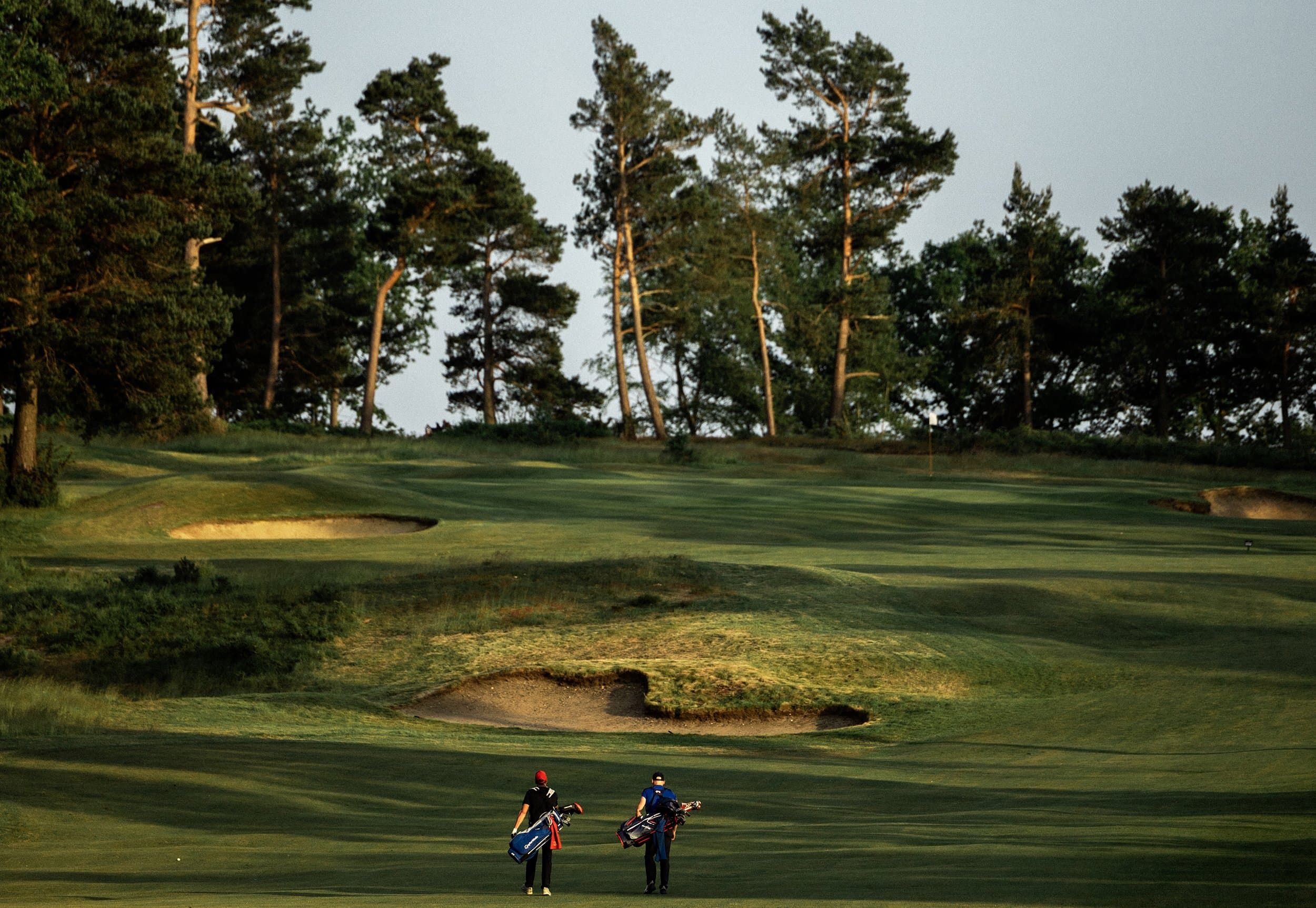 Two members walking down the fairway